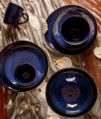 still life photography of fruits and blue cutlery