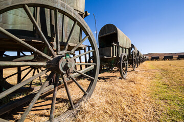 Circle of 64 replica Voortrekker wagons cast in bronze at Blood River Heritage Site, KwaZulu-Natal,...