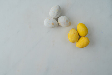 easter eggs in patriotic colors on a marble table. flat lay. place for text. minimalist concept happy