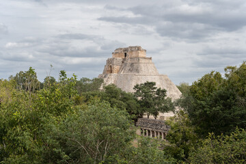 Fototapeta na wymiar Uxmal temple complex in Yucatan, Mexico, grey sky