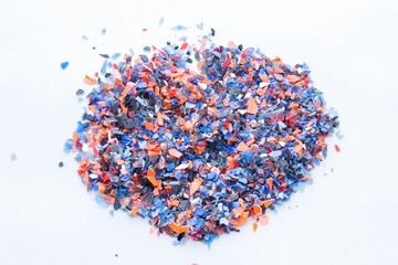 A pile of microplastics - small pieces of hard plastic, intended for further processing....