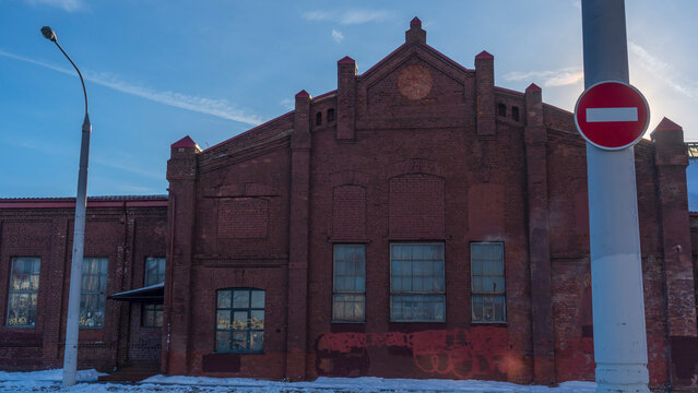 No entry sign in an old town. Red no entry traffic sign on old building background. The road is closed red round sign.