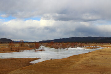 Frozen river landscape in springtime