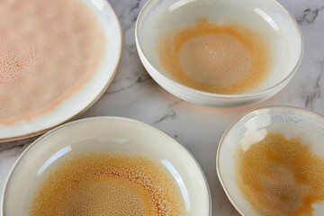 Still life photography of yellow cyan ceramic utensils