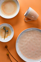 Still life photography of yellow cyan ceramic utensils
