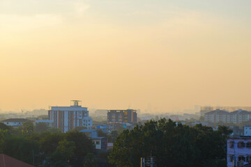 Fototapeta na wymiar Morning sunrise with fog over city building