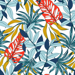 Original seamless tropical pattern with bright plants and leaves on a white background. Tropic leaves in bright colors. Seamless exotic pattern with tropical plants.