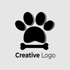 Vector logo of animal footprints and bones in black on white background