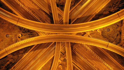 Aerial drone long exposure night shot of elevated urban junction motorway with light traffic and light trails © aerial-drone
