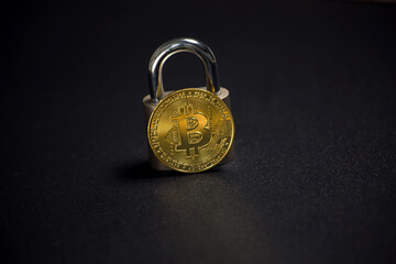 Bitcoin and lock. Cryptocurrency investment security and safety concept