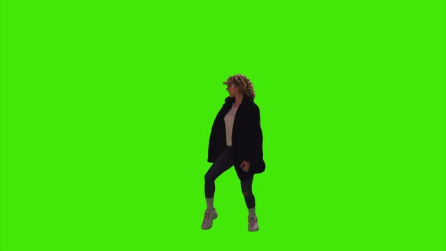 An energetic girl with brown hair dancing happily in a disco on greenscreen
