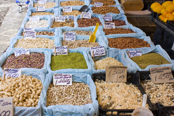 Nuts and spice for sale at street  market in Sicily, Italy