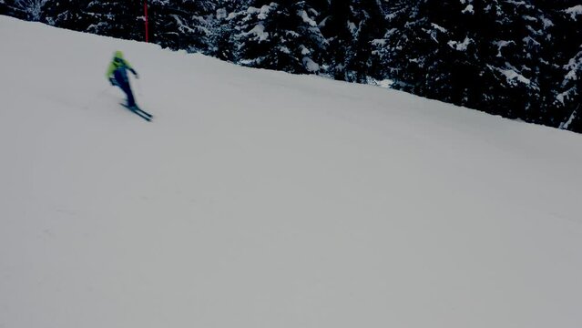 Aerial trucking close shot of the few skiers in the deserted Arosa Lenzerheide ski resort in Switzerland completely empty due to the sanctions against Russian tourists after the invasion of Ukraine