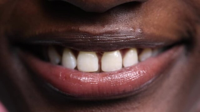 Close-up mouths, lips and teeth of young multi ethnic people smiling. Concept of beauty, diversity, youth, art and dental health. 4k