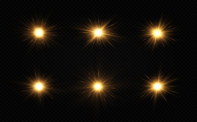 Shining golden stars isolated on black background. The star burst with brilliance. Glow effect.