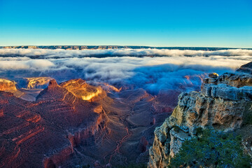 Fototapeta na wymiar The Grand Canyon at Sunrise with Fog in the Canyon