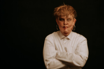 Obraz premium psychopath with mental disorders and insanity on a dark background. A blurry portrait of a woman in a straitjacket