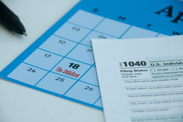 Tax deadline text on April calendar - Tax submission due date concept