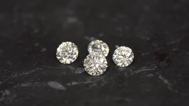 Diamonds sparkle. Diamond shine. 1 carat diamond close-up macro shot panning slow motion.
