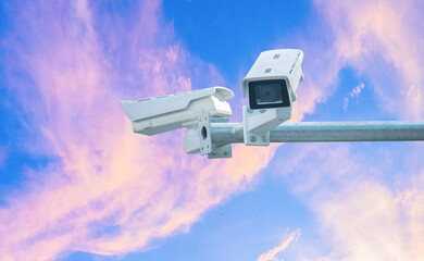 CCTV camera on  bright sky background 24 hour security equipment