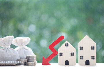 Finance, Model house with red arrow graph and money bag on natural green background,Business investment and Save money for prepare in future concept,Inflation