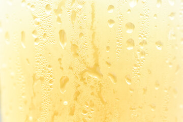Abstract close-up yellow water drop texture background
