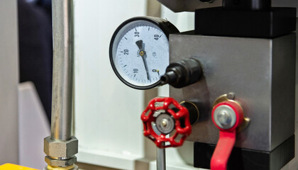 Close up of manometer on hydraulic equipment