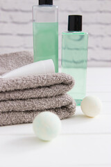 Obraz na płótnie Canvas Relax concept beauty products cotton towels vertical front view.