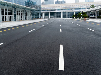 Asphalt road with white dashed lines