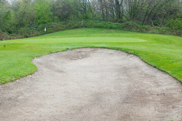 Golf course with bunker and green