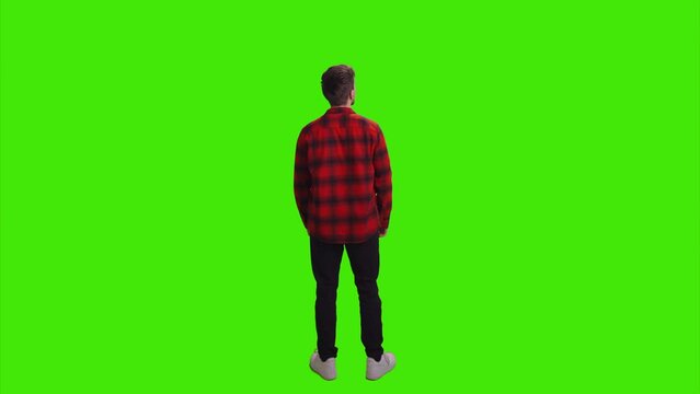 A Man Standing In City Facing The Opposite Direction On Greenscreen