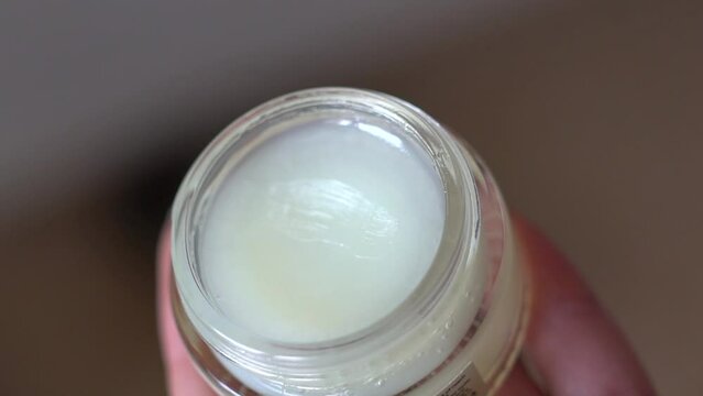Pick up hygienic lipstick from a jar with a stick
