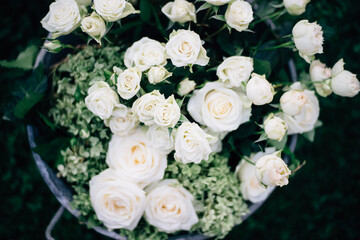 Top view of a wedding floral arrangement with white roses.