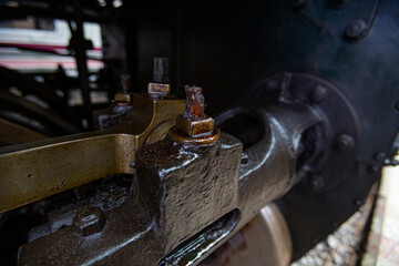 Metal parts filled with oil and dust of the steam locomotive