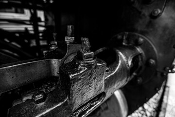Black and white Metal parts filled with oil and dust of the steam locomotive