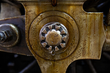Metal parts, nuts, metal rods filled with oil and dust of steam locomotives
