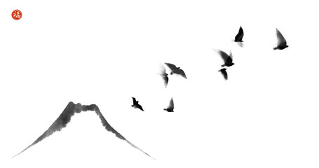 Ink painting of black flying birds and Fujiyama mountain. Traditional oriental ink painting sumi-e, u-sin, go-hua. Translation of hieroglyph - well-being