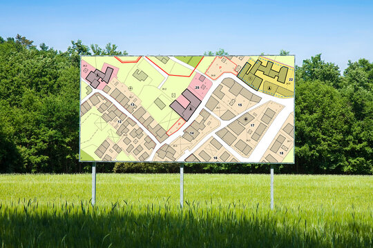 Advertising billboard with an imaginary General Urban Plan with indications of urban destinations buildable areas, land plot - NOTE: the map is totally invented and does not represent any real place