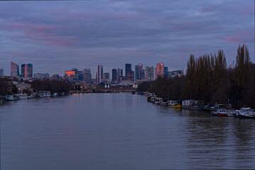 Skyline of La Defense Business District at Twilight in Paris With Seine River