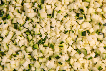 Chopped raw zucchini, close-up, diced zucchini macedonia