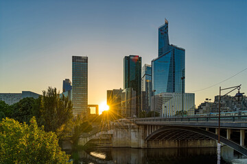 Fototapeta premium La Defense District in Paris at Sunset With Traffic and Seine