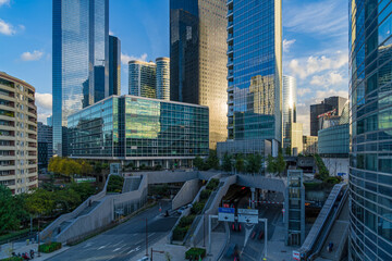 High Towers and Light Reflections With Traffic Under Cloudy and Sunny Day