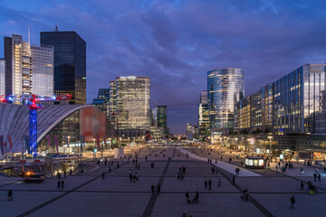 La Defense Business District at Evening With Employees Under Purple and Stormy Sky