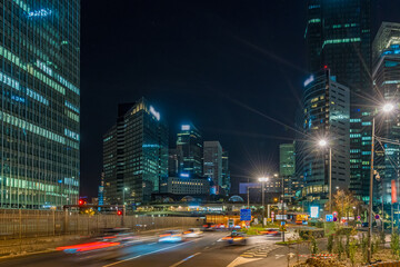 Night Road Traffic at La Defense Business District With Towers Skyline