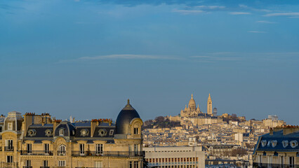 Fototapeta na wymiar Sunrise Over Sacred-Heart Basilica and La Defense in Paris