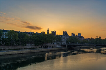 Orange Sky at Golden Hour Sunrise Over Paris Center With Seine River and Bridge