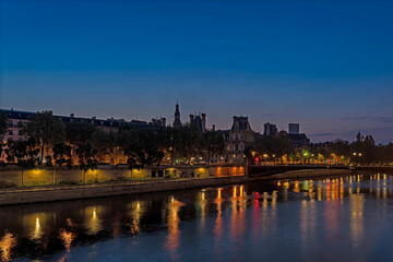 Fototapeta na wymiar Paris Center With Seine River Historical Buildings and City Hall at Dawn