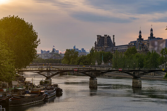 Sunny and Cloudy Sky Over Paris Center With Famous Buildings and Seine River