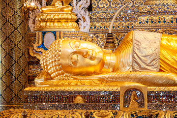 The golden reclining Buddha image is revered The golden reclining Buddha image is revered by...