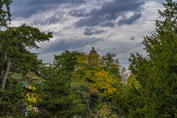 Paris Public Park at Day Under Cloudy Sky Trees and Monument